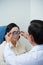 Ophthalmologist helping senior patient