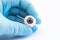 Ophthalmologist or surgeon holds in hand dressed in a blue glove eye eyeball. Concept photo for ocular prosthesis, diagnosis and