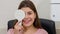 Ophthalmology treatment - young smiling woman checking her visual acuity - closing her eye with an eye shield and saying