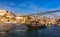 Oporto or Porto city skyline, Douro river, traditional boats and