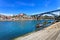 Oporto or Porto skyline, Douro river, boats and iron bridge. Portugal, Europe.