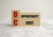 opportunity cost words on wooden cubes and white background