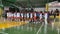 Opposing teams of young active males meet each other in Sepak Takraw or Foot Volleyball sportsmanship opening ceremony