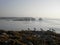 Opposite lines of gulls and rocks