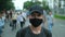 Opposition person protesting in facemask under covid epidemic restrictions.