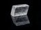 Optical Calcite from China isolated on a black mirror background. Alternative stone name: Iceland Spar