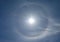 Optical phenomenon called 22 degree halo around the sun