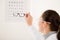 Optician doctor woman with glasses and eye chart