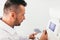 Optician examining patient`s eye on a machine.