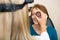 Optician Examining Senior Woman\'s Eye