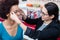 Optician showing woman new glasses