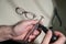 An optician technician polishes the frame of glasses. A professional optician fixes glasses.