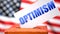 Optimism and American elections, symbolized as ballot box with American flag in the background and a phrase Optimism on a ballot