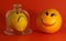 Optimism and pessimism concept. lemon with a sad smiley face and orange with a cheerful smiley