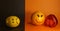 Optimism and pessimism concept. lemon with a sad smiley face and orange with a cheerful smiley