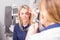 Optometrist checking woman\'s vision