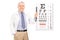 Optometrist holding glasses in front of eye chart