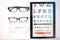 Optometry, glasses and letter for eye exam on tablet for sight, vision testing and medical care. Optometrist, healthcare