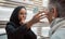 Optometry, vision and eye test with an islamic woman optician working to diagnose a customer. Doctor, optometrist and