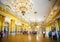 Opulent gold chandaliered state room in The Hermitage Museum in St Petersburg, Russia