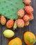 Opuntia cactus. Exotic fruits on old wooden background.