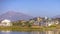 Oquirrh Lake with homes against mountain and sky