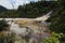 Orakei Korako hidden geothermal valley - Emerald terrace, New Zealand: View on colorful rainbow sinter terrace