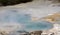 Orakei Korako hidden geothermal valley: View on steaming blue hot pool