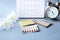 Oral contraceptive pills, calendar and period time concept background