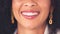 Oral hygiene closeup of a woman smiling and showing her perfect white teeth. Confident young black woman with a flawless