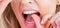 Oral hygiene and health care. Smiling women use dental floss white healthy teeth. Dental flush - woman flossing teeth