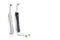 Oralcare Concepts. Pair of Professional Electric Toothbrushes With Spare Attachments Placed Together on White