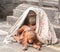 Orang utan with baby playing under a blanket