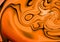 Orange abstract waves texture background reminding halloween pumpkins