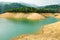 Orange aqueous rock and clear water