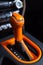 Orange automatic shifter inside the car.