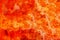 Orange background: red metal art painted strong red, orange and white vivid colours colourful surface texture background