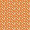 Orange background scattered dots polka seamless pattern