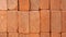 Orange baked bricks stacked together