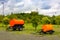 orange barrel trailer stands in the parking lot.