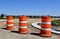 Orange barrels block road construction site