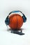 Orange basket ball, headphone and mobile phone.