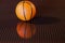 Orange basket ball and his reflected image