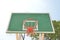 Orange basket on basketball green board