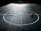 Orange basketball on court in gymnasium sport competition floor background