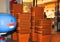 Orange baskets with which to shop at the supermarket stacked at the entrance to the store