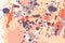 Orange beige grey ink splashes background