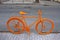 Orange bicycle on the street