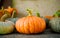 Orange big pumpkins among green pumpkin