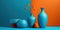 Orange and blue background. Pottery vases, flowers still life. Minimalist color block interior.